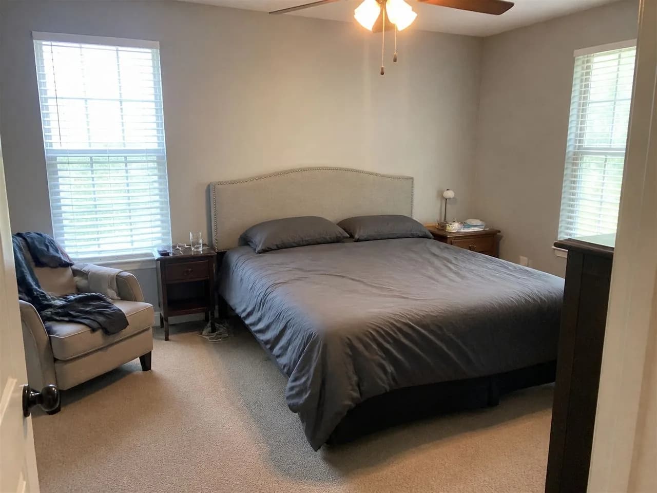 A plain bedroom photographed on a phone, before the AI redesign