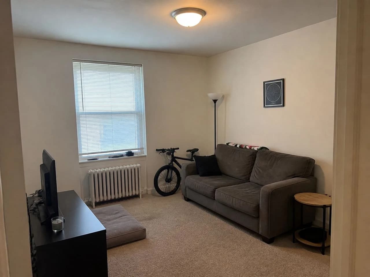 A small living room before the AI redesign, an ordinary phone photo