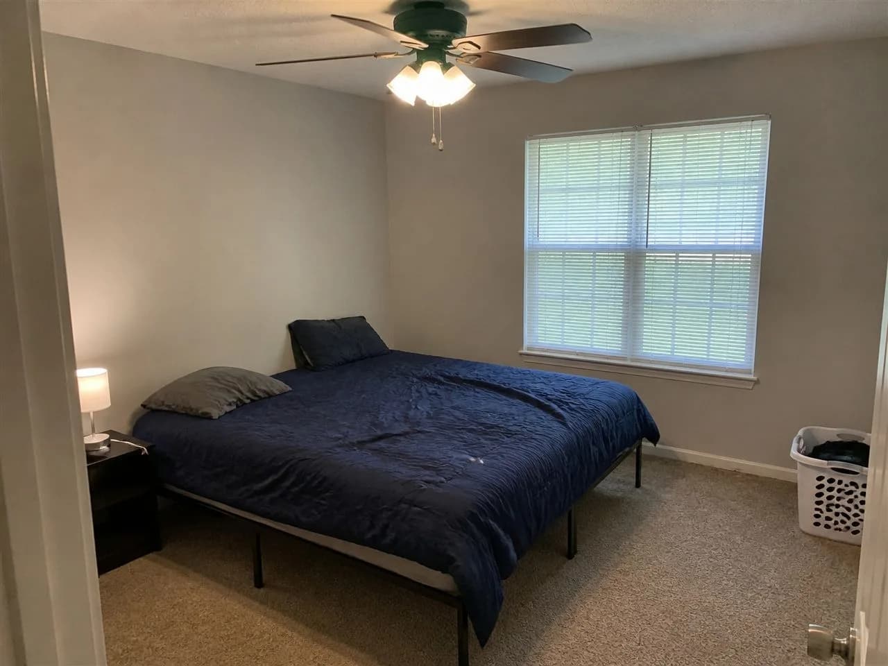 Bedroom before the AI redesign, an ordinary phone photo