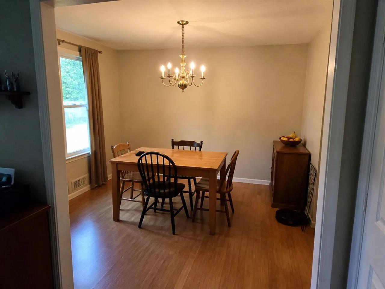 Dining room before the AI redesign, an ordinary phone photo